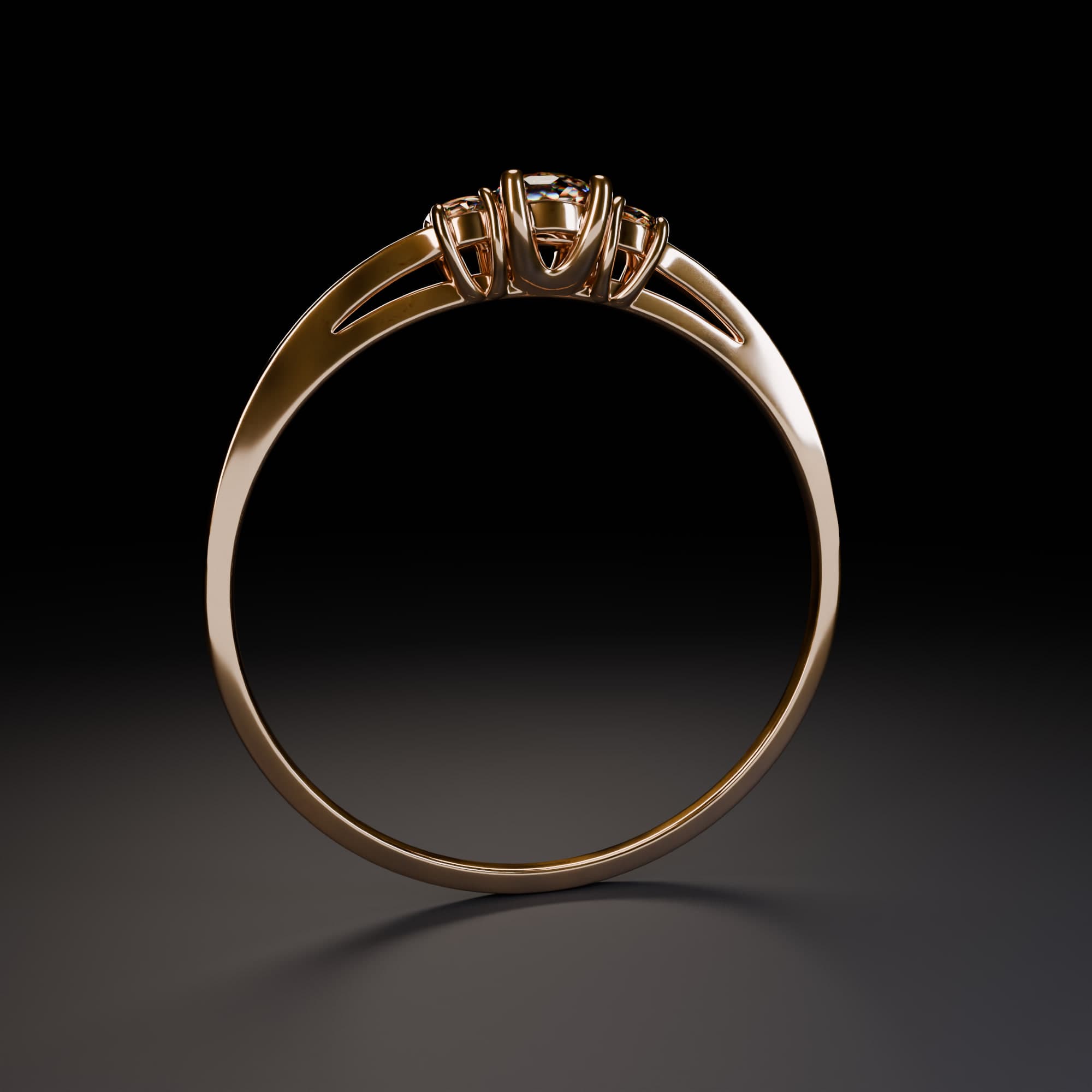 The triple diamond ring from the side, showing the three stones set on the braided gold band.